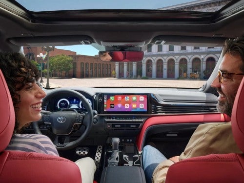 2025 Toyota Camry interior view looking up at front of vehicle with couple in front seats